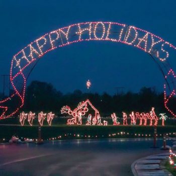 A holiday lights display that says "Happy Holidays." Photo Credit Sunshine Division.