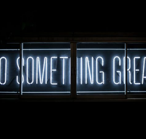 A neon sign that says "Do Something Great"